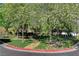 Community park with grass, mature trees, and a walking path at 9931 Cherry Melee Ave, Las Vegas, NV 89148