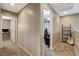 Upper hallway with doors leading to bedrooms and a loft area, with carpet floors at 9931 Cherry Melee Ave, Las Vegas, NV 89148