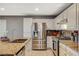 Kitchen featuring granite counters, stainless steel appliances, and tile flooring at 9931 Cherry Melee Ave, Las Vegas, NV 89148