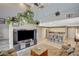 Open layout of the living room flowing into the kitchen area with seating at 9931 Cherry Melee Ave, Las Vegas, NV 89148