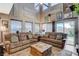 Comfortable living room featuring large windows and a view of the backyard at 9931 Cherry Melee Ave, Las Vegas, NV 89148