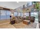Bright living room with large windows and a sliding door for indoor/outdoor living at 9931 Cherry Melee Ave, Las Vegas, NV 89148