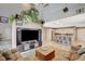 Open living room with tall ceilings that flows into kitchen area with barstool seating at 9931 Cherry Melee Ave, Las Vegas, NV 89148