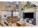 A cozy living room featuring large windows, a sliding door and comfortable seating at 9931 Cherry Melee Ave, Las Vegas, NV 89148