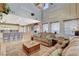 Open-concept living room with a kitchen island and comfortable seating at 9931 Cherry Melee Ave, Las Vegas, NV 89148