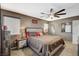 A comfortable main bedroom suite with neutral colors, natural light and ceiling fan at 9931 Cherry Melee Ave, Las Vegas, NV 89148