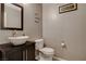 A lovely powder room with a stylish vanity and faucet, along with a humorous wall hanging at 9931 Cherry Melee Ave, Las Vegas, NV 89148