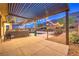 An outdoor kitchen sits near the pool and lounge area at 10149 Terrastone Dr, Las Vegas, NV 89148