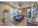 This dining room features hardwood floors and a unique wood accent wall at 10149 Terrastone Dr, Las Vegas, NV 89148
