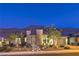 Contemporary home features a landscaped front yard, lighted walkway and mountain views at 10149 Terrastone Dr, Las Vegas, NV 89148