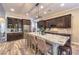Gourmet kitchen with a large island, stainless steel appliances and dark cabinetry at 10149 Terrastone Dr, Las Vegas, NV 89148