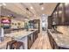 Open kitchen with a large island, stainless steel appliances and view into the living room at 10149 Terrastone Dr, Las Vegas, NV 89148