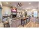 Spacious living room with fireplace, wood-look floors, beamed ceiling and lots of seating at 10149 Terrastone Dr, Las Vegas, NV 89148