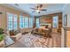 Bedroom with wood accent wall, plantation shutters, and neutral colors at 10149 Terrastone Dr, Las Vegas, NV 89148