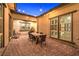 The outdoor patio includes brick pavers and a dining table for entertaining at 10149 Terrastone Dr, Las Vegas, NV 89148