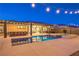 A beautiful backyard pool and spa are next to an outdoor kitchen at 10149 Terrastone Dr, Las Vegas, NV 89148