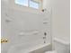 Bright bathroom featuring a tiled shower-tub combination and modern fixtures at 10162 Sunshine Village Pl, Las Vegas, NV 89183