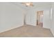 Bright bedroom with neutral carpet, a ceiling fan, and ensuite bathroom at 10162 Sunshine Village Pl, Las Vegas, NV 89183