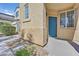 Close-up of the front door of the house with a well-manicured rock garden at 10162 Sunshine Village Pl, Las Vegas, NV 89183