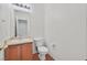 Bright half bathroom with a single sink vanity and tile flooring at 10162 Sunshine Village Pl, Las Vegas, NV 89183
