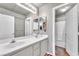 Clean bathroom with double sinks, white cabinets, and a shower-tub combination at 1035 Tabor Hill Ave, Henderson, NV 89074