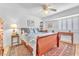 Inviting bedroom with a queen-sized bed, hardwood floors, and shuttered windows at 1035 Tabor Hill Ave, Henderson, NV 89074