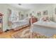 Cozy bedroom with two twin beds, plush toys, and natural light at 1035 Tabor Hill Ave, Henderson, NV 89074