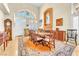 Elegant dining room with high ceilings, chandelier, and a large dining table perfect for entertaining at 1035 Tabor Hill Ave, Henderson, NV 89074