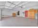 Large two-car garage with ample storage space and an epoxy floor, perfect for projects and parking at 1035 Tabor Hill Ave, Henderson, NV 89074