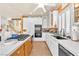 Bright kitchen with white cabinets, stainless steel appliances, and tile flooring at 1035 Tabor Hill Ave, Henderson, NV 89074