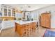 Spacious kitchen features a large island, white cabinets, and stainless steel appliances at 1035 Tabor Hill Ave, Henderson, NV 89074
