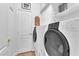 Well-equipped laundry room with modern washer, dryer, and storage at 1035 Tabor Hill Ave, Henderson, NV 89074