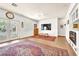 Bright living room with tile floors, area rug, and access to the pool area at 1035 Tabor Hill Ave, Henderson, NV 89074