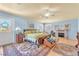 Bright main bedroom with pale blue walls, a fireplace, and a back yard view at 1035 Tabor Hill Ave, Henderson, NV 89074