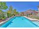 Backyard pool features crystal clear water, a small spa, and lounge chairs for ultimate relaxation at 1035 Tabor Hill Ave, Henderson, NV 89074