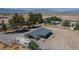 Aerial view of home with desert landscape, carport, and space for your vehicles at 1050 Bruce St, Pahrump, NV 89048