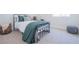 Charming bedroom with a metal frame bed, decorative pillows, a basket, and a gray woven floor cushion at 1050 Bruce St, Pahrump, NV 89048