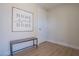 Entryway with a 'Home Sweet Home' sign, a wood bench, neutral wall paint, and wood-look floors at 1050 Bruce St, Pahrump, NV 89048