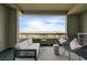 Cozy balcony with comfortable seating, stylish decor, and a pleasant view of the surrounding neighborhood at 11280 Granite Ridge Dr # 1035, Las Vegas, NV 89135