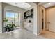 Open concept dining area with bar and sliding glass doors to the outdoor patio at 11280 Granite Ridge Dr # 1035, Las Vegas, NV 89135