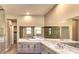 Spacious bathroom boasting dual vanities, a soaking tub, and a walk-in glass shower at 11280 Granite Ridge Dr # 1035, Las Vegas, NV 89135