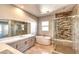Luxurious bathroom with a soaking tub, glass-enclosed shower, and marble countertops at 11280 Granite Ridge Dr # 1035, Las Vegas, NV 89135