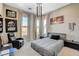 Comfortable bedroom features ample natural light, a cozy bed, and unique decor for a personalized touch at 11280 Granite Ridge Dr # 1035, Las Vegas, NV 89135