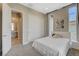 Airy bedroom features plush carpet, lots of natural light, and ensuite bathroom access at 11280 Granite Ridge Dr # 1035, Las Vegas, NV 89135