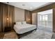 Tastefully decorated bedroom with plush carpet, and a balcony over looking the city at 11280 Granite Ridge Dr # 1035, Las Vegas, NV 89135