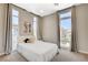 Bright bedroom offers tall ceilings and windows, plush carpet, and neutral colors for a relaxing atmosphere at 11280 Granite Ridge Dr # 1035, Las Vegas, NV 89135