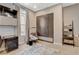 Bedroom with large closet, built-in desk, neutral carpet, and a chair with a small table at 11280 Granite Ridge Dr # 1035, Las Vegas, NV 89135