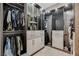 Organized walk-in closet with custom shelving, hanging rods, and ample storage space at 11280 Granite Ridge Dr # 1035, Las Vegas, NV 89135