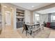 Inviting dining area boasts a modern table with seating, a coffee bar, and access to the open-concept living spaces at 11280 Granite Ridge Dr # 1035, Las Vegas, NV 89135