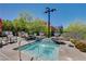 Community hot tub with waterfall feature and lush landscaping at 11280 Granite Ridge Dr # 1035, Las Vegas, NV 89135
